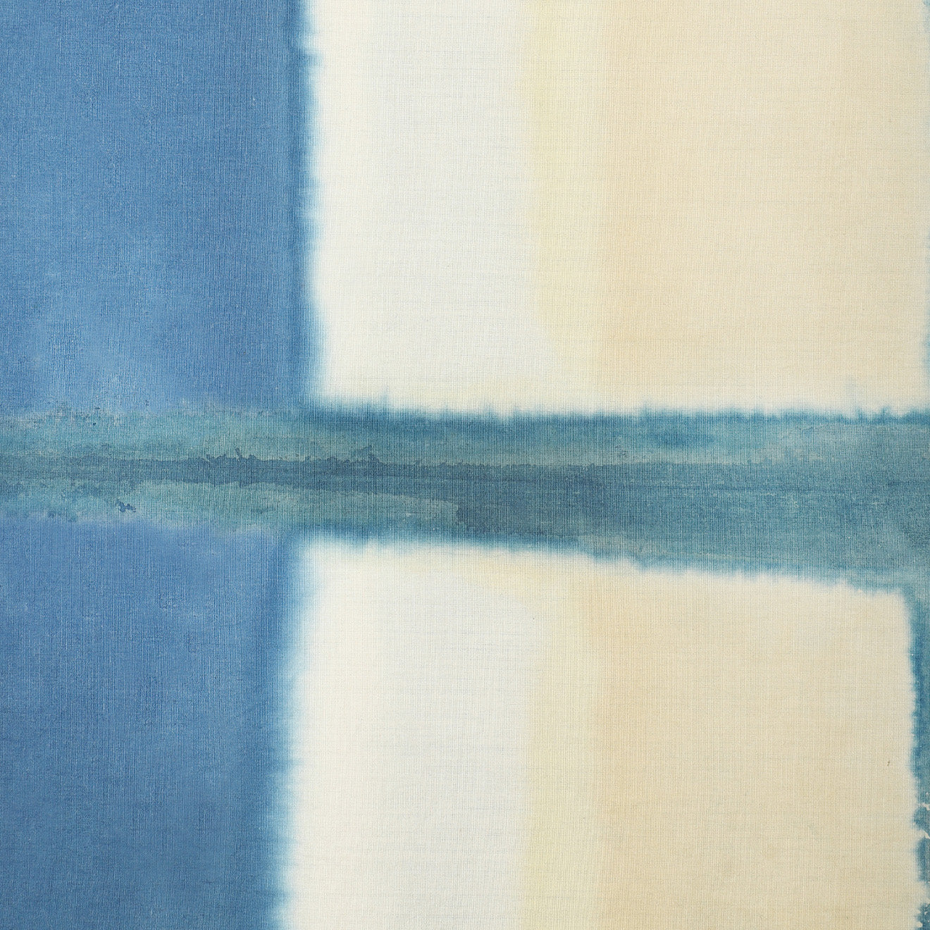 Kardo’s Tie, Yellow Clamp Dye features a tie-dye pattern with blue, cream, and yellow vertical and horizontal bands that form a blurred cross shape.