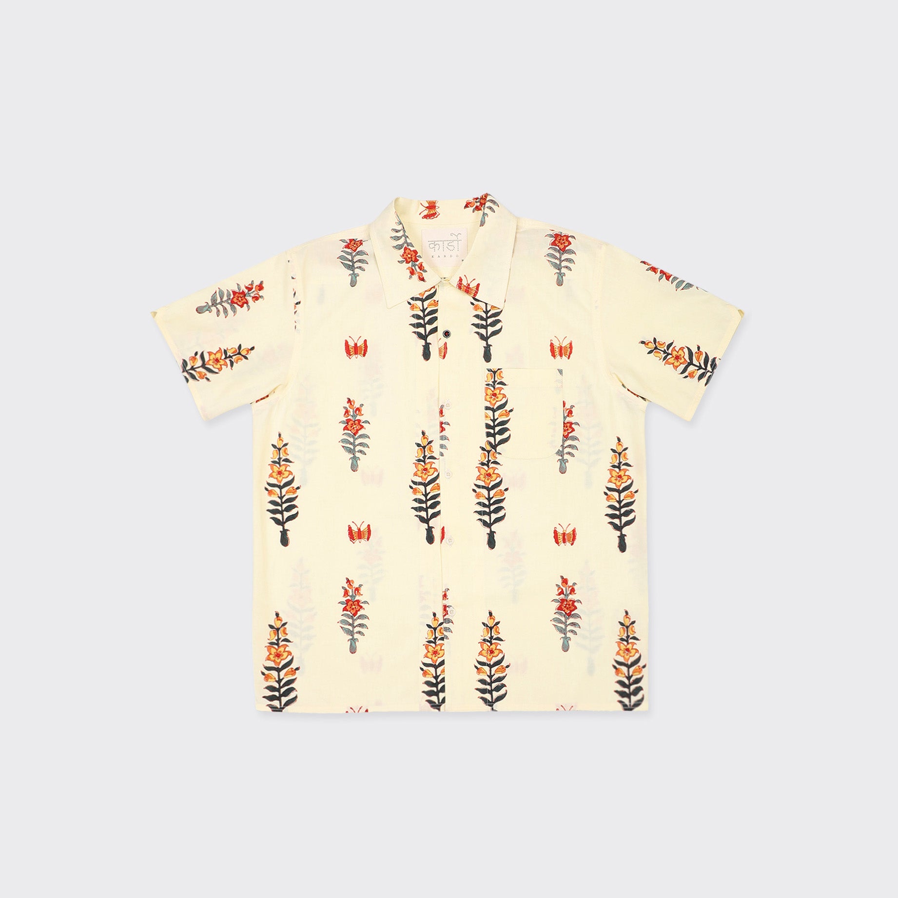 The Kardo Chintan SS Shirt, Block Print 138, features short sleeves, a button-up front, and a beige base with an orange, black, and yellow floral pattern.