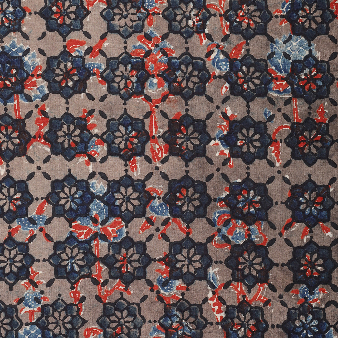 The Kardo Bandana 21" x 21", Ajrakh 23, features a geometric, symmetrical floral pattern in navy blue, red, and light blue on a beige background.