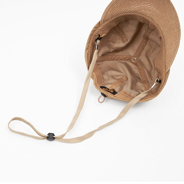 The Charidoor Cap by Sublime Roe is a tan bucket hat shown from above, featuring mesh lining and an adjustable chin strap, displayed on a white surface.