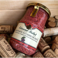 A jar of Edmund Fallot Dijon Mustards, labeled "Moutarde aux Cassis de Dijon," rests amidst several corks.