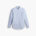 The Dockers Men's Signature Comfort Flex Shirt, LS, shown on a white background, is a light blue stretch poplin button-up with subtle vertical stripes, long sleeves, a chest pocket, classic collar, and wrinkle-resistant comfort.