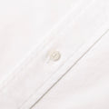 Close-up of the Gitman Vintage Classic White Oxford shirt, showcasing a white button and detailed stitching along the placket.