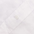 Close-up of the Gitman Vintage White Linen Shirt, highlighting a single white button on its stitched placket.