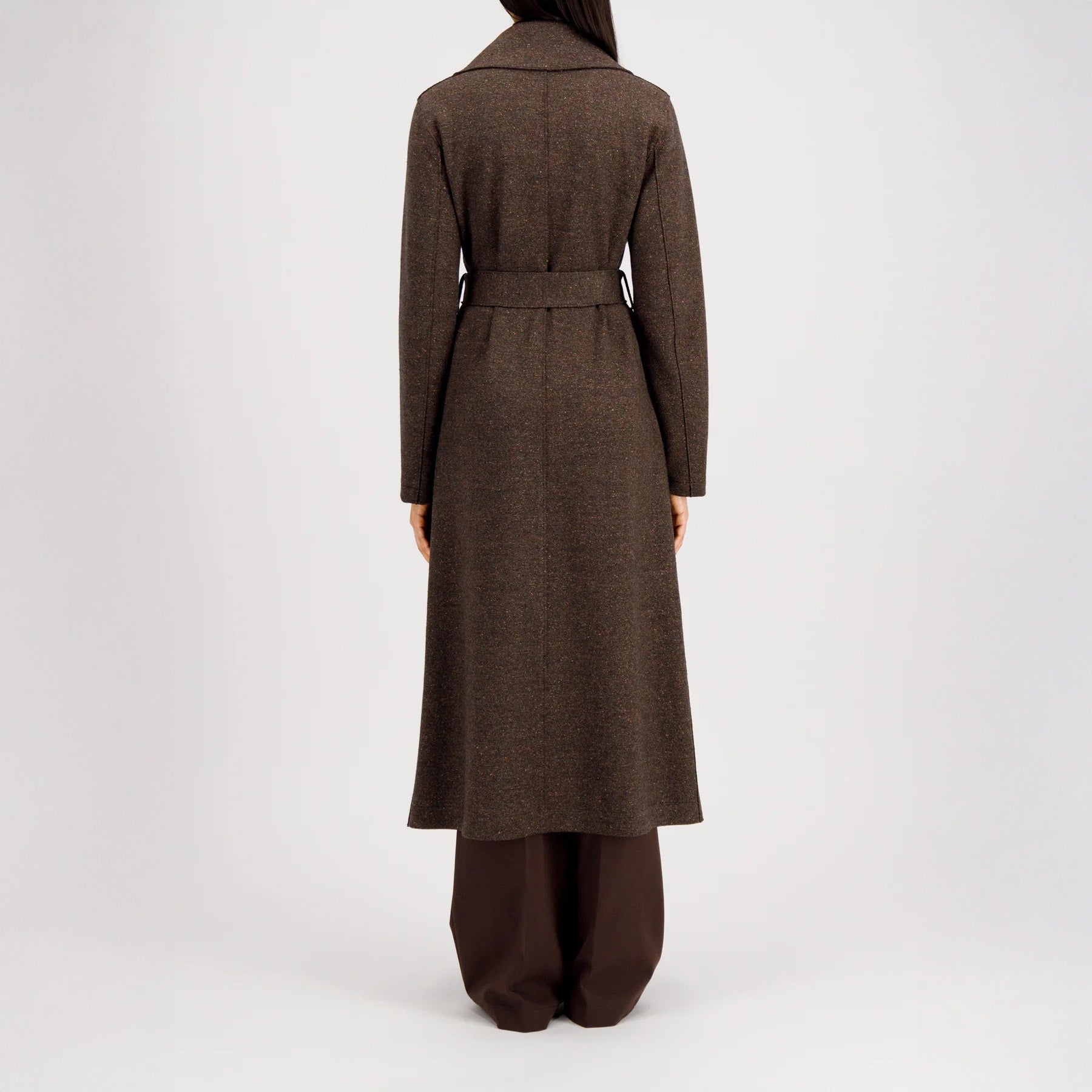 A person wearing the Harris Wharf W Long Maxi Coat Donegal and wide-leg brown pants, shown from the back against a plain light background.