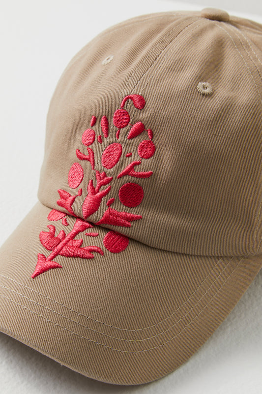 Beige Big Buti Baseball Cap with detailed red floral embroidery and the Free People Movement logo on the front, pictured on a white background.