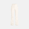 The Emma Pant by Halfdays is a white, flared, high-waisted pant with a sleek, slim-fit design, perfect for après-ski style against a plain background.