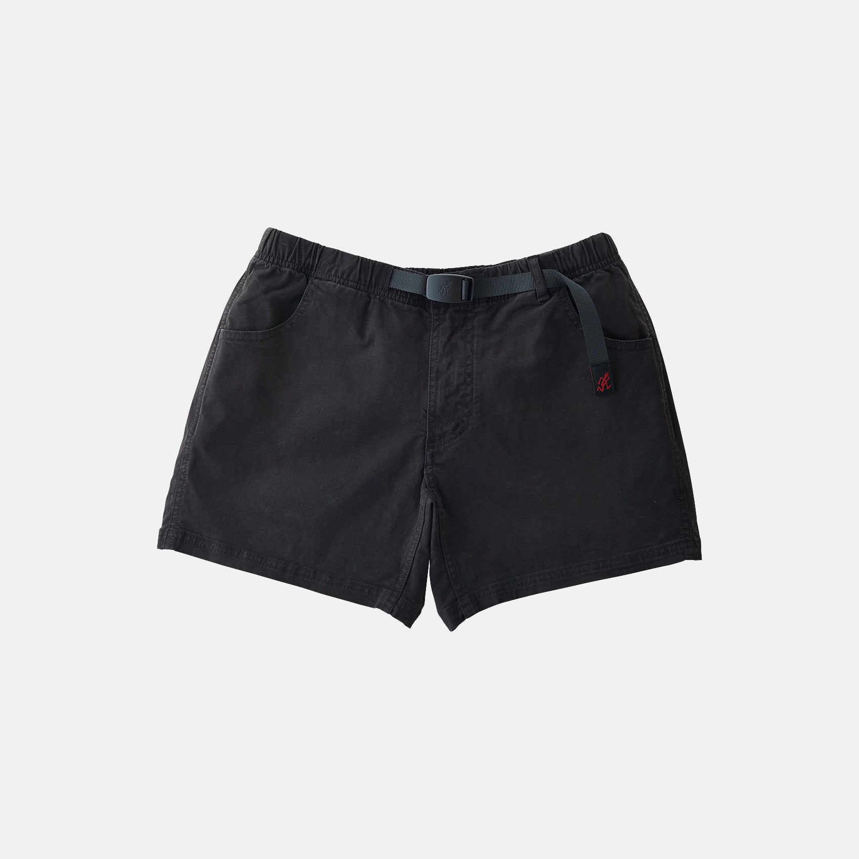 The Gramicci Very Short in black, made from cotton stretch twill, features an integrated belt, elastic waistband, and side pockets—ideal for casual wear.