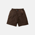 The Gramicci Nylon Loose Short, in brown, features knee-length nylon fabric, an elastic waistband with an integrated adjustable belt, and offers wind-resistant and water-repellent protection. Shown on a plain white background.