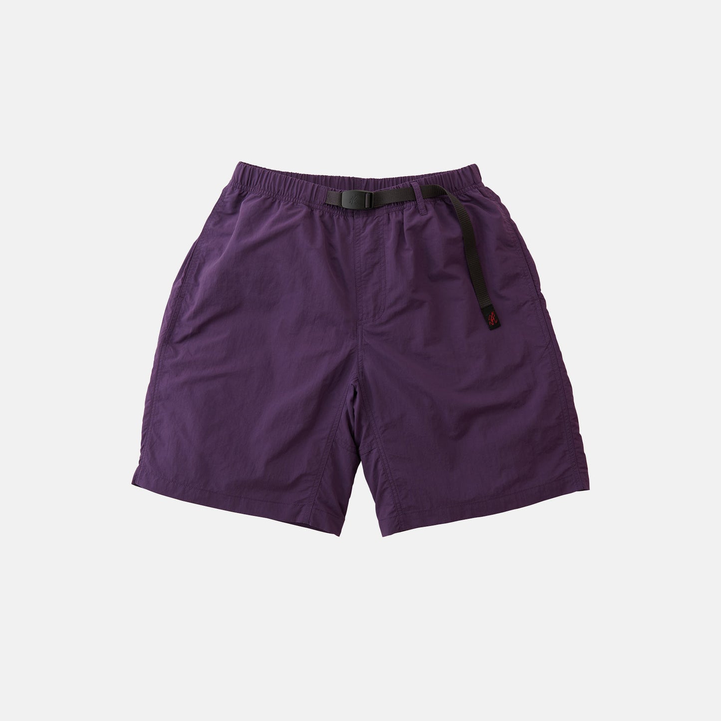 The Gramicci Nylon Loose Short is a pair of purple, water-repellent nylon shorts with an elastic waistband and integrated black adjustable belt, shown on a white background.