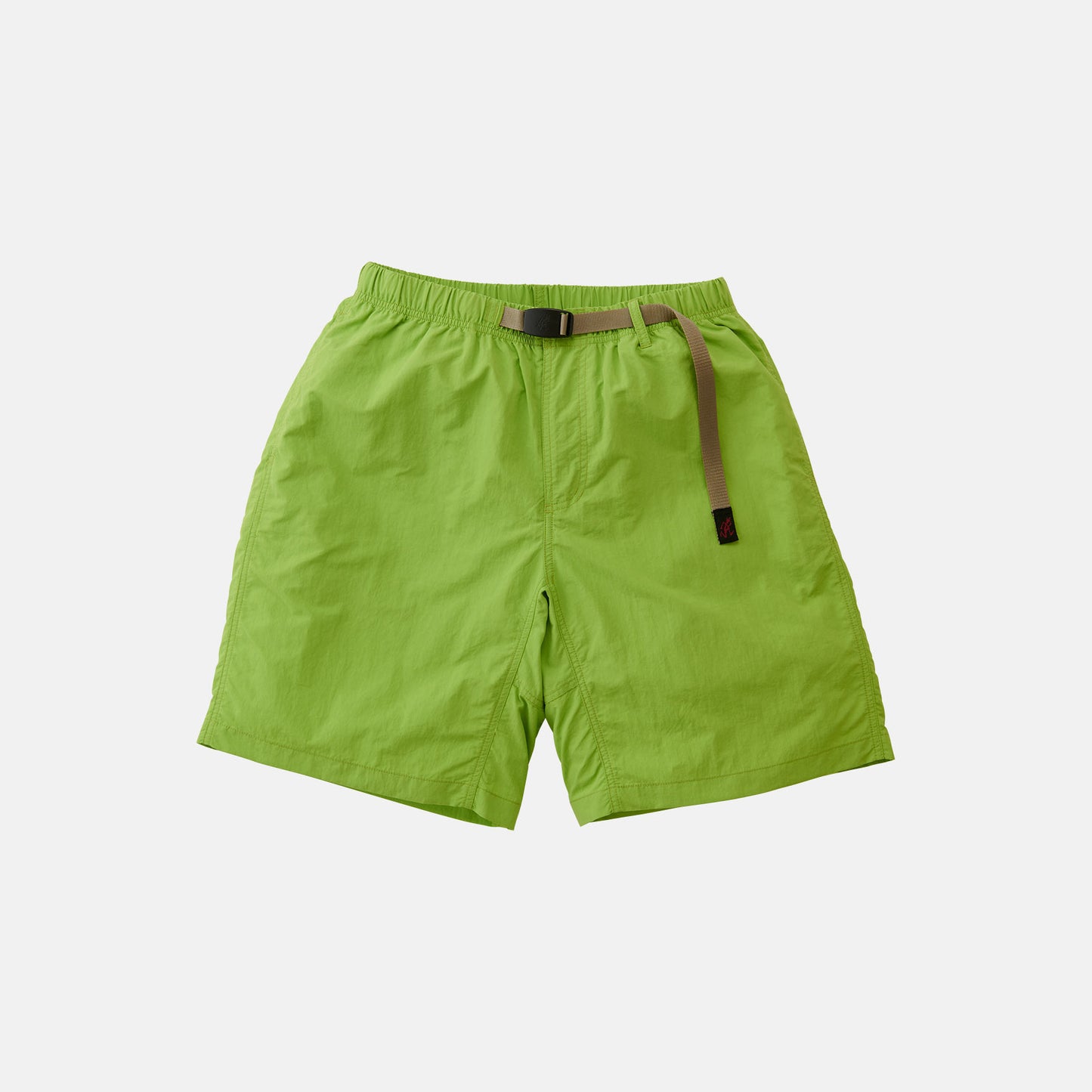 The Gramicci Nylon Loose Short in lime green features an elastic waistband, adjustable webbing belt, and side pockets. These wind-resistant, water-repellent shorts are shown on a plain white background.