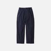 The Gramicci Trekking Pant in dark navy blue features straight legs, an elastic waistband with built-in belt, and side pockets, shown laid flat on a plain white background.