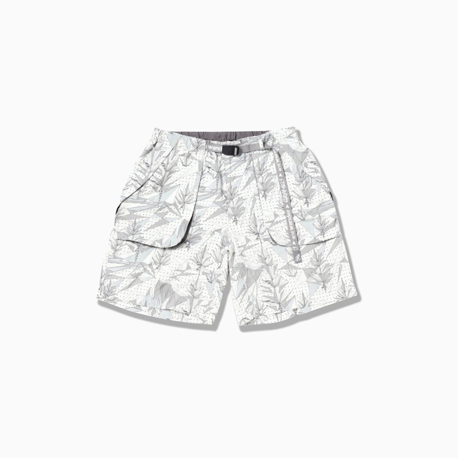 Brushed Nylon Short by Gramicci x And Wander in light gray features a subtle leaf pattern and comes with a built-in belt.