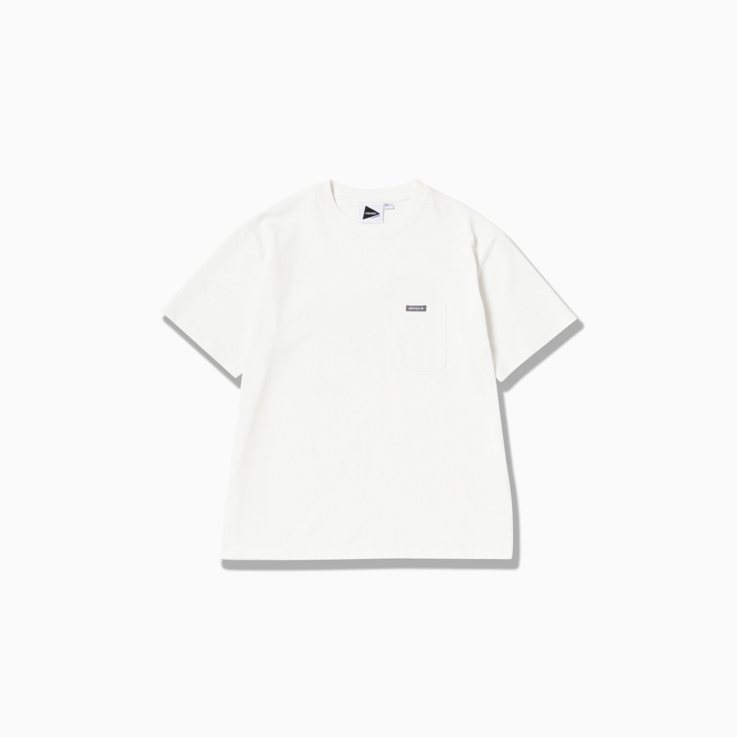 Gramicci x And Wander's Backprint Tee, a white short-sleeve shirt, features a small rectangular label on the left chest pocket, showcased against a plain background.