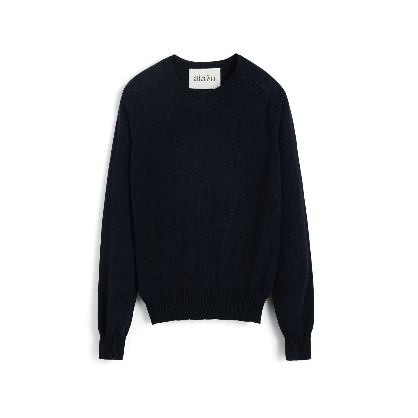 The Aiayu Gina Sweater is a black crewneck made from 100% merino wool, featuring long sleeves and ribbed cuffs, displayed against a white background.