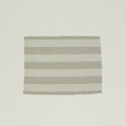 The Hawkins New York Essential Floor Mat, Light Grey, is made from 100% recycled fibers and features alternating light gray and white horizontal stripes for a subtle pop of color. It's machine washable for easy care.