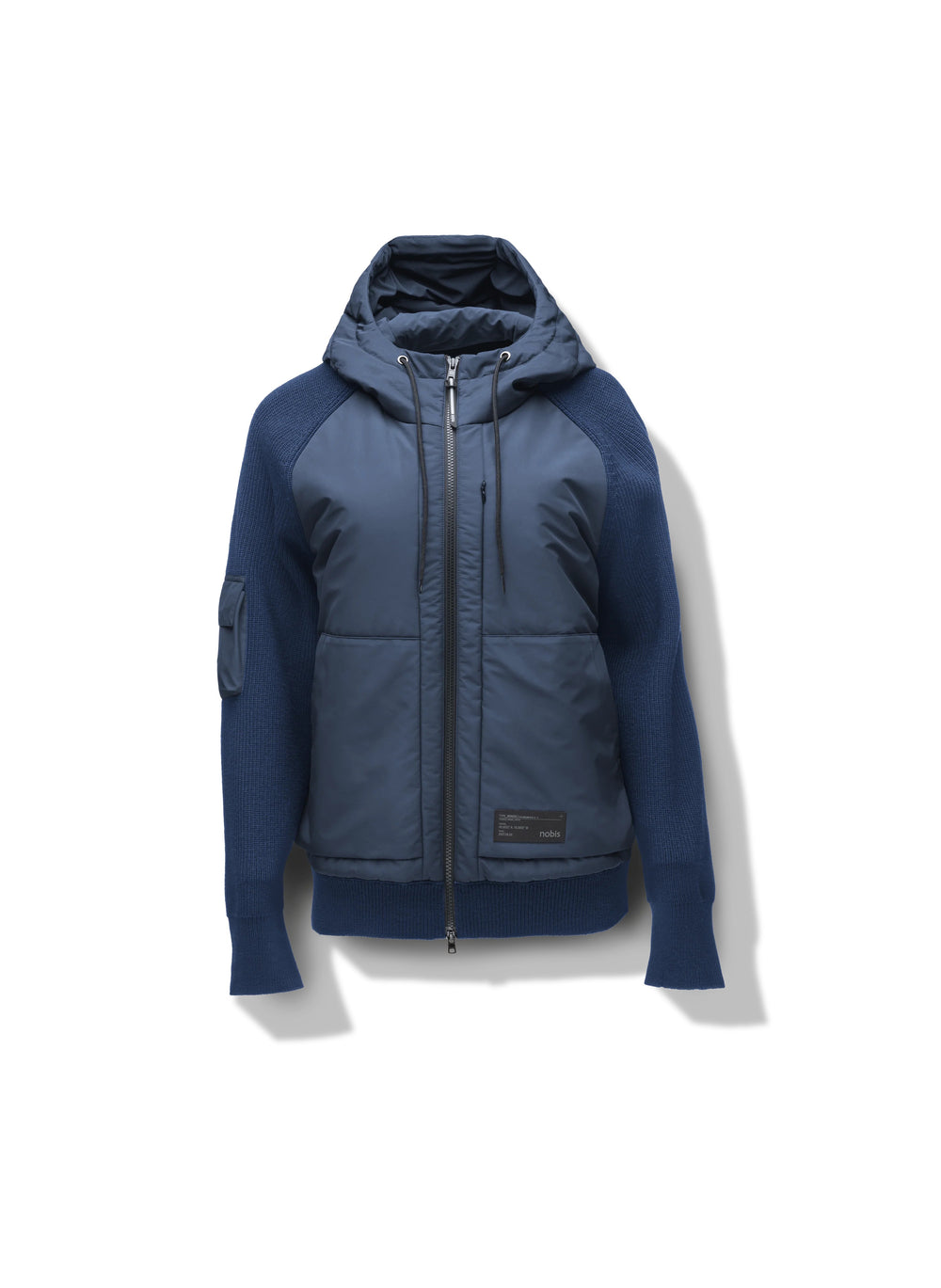 The Hedge Men's Performance Hoodie by Nobis is a luxurious hoodie with a blue quilted front and ribbed sleeves, featuring a full zip closure. This stylish jacket includes a convenient side pocket on the sleeve and offers water resistance for added practicality.