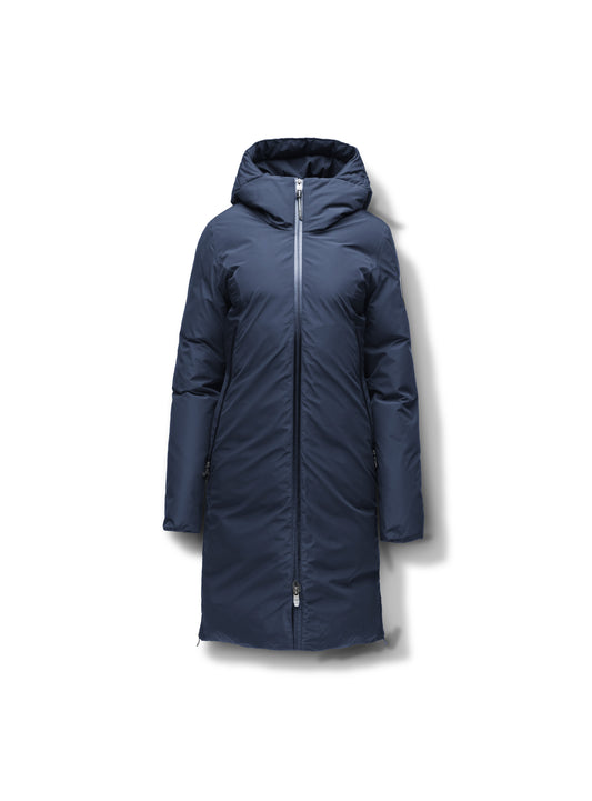The Nobis Inara Women's Performance Parka is a navy blue hooded winter coat with adjustable snap cuffs, premium Canadian White Duck Down fill, a full-length front zipper, and long sleeves, elegantly shown on a white background.