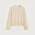 The Aiayu Inga Sweater is a beige, long-sleeve cashmere piece with classic ribbed cuffs and hem, elegantly showcased against a neutral backdrop.