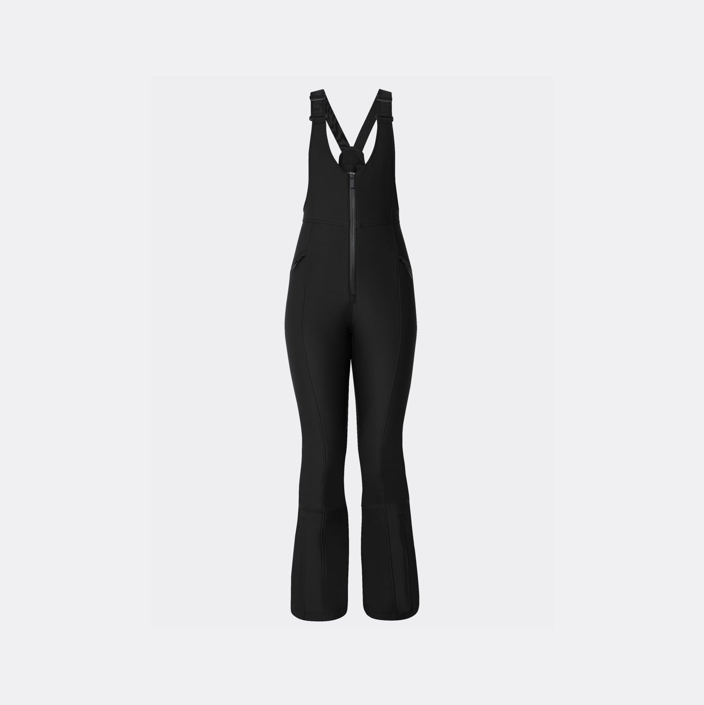 The Isabel Soft Shell Bib Pant by Halfdays is a black slim-fit ski bib with adjustable shoulder straps and a front zipper, made from soft shell material for winter sports.