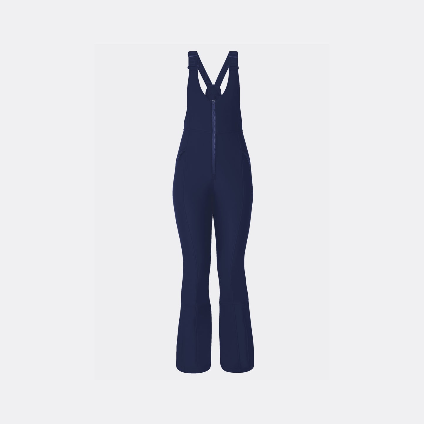 The Halfdays Isabel Soft Shell Bib Pant is a dark blue, slim-fit ski overall featuring adjustable straps, flared legs, and a front zipper for convenience. It is crafted from soft shell fabric for comfort and is displayed against a plain white background.