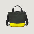 The New York Tote Small, Special Edition: Forest Green/Yellow by Bags in Progress features black handles, an adjustable strap, handy external pockets for extra storage and a forest green design with a bright yellow bottom.