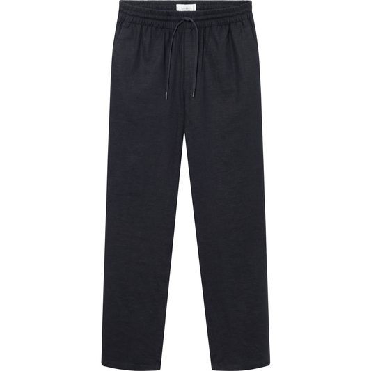 Patrick Linen Pants in Dark Navy by Les Deux, made from breathable material, with a drawstring waist, displayed on a neutral background.