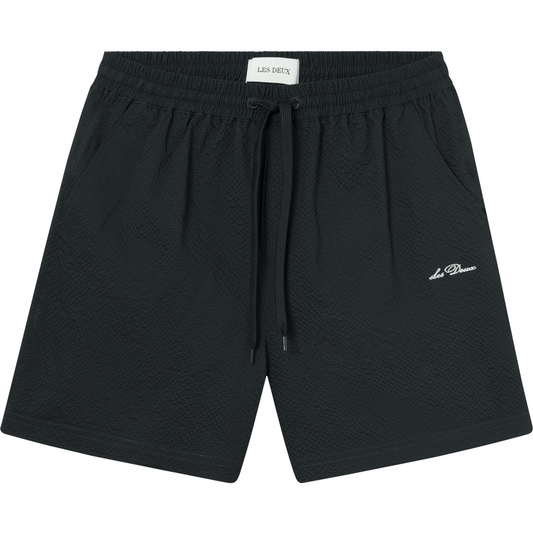 Black Les Deux Stan Seersucker Swim Shorts 2.0 with an elasticated drawstring waist, and embroidered logo on the lower left leg.