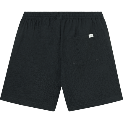 Les Deux Stan Seersucker Swim Shorts 2.0 in Dark Navy with an elasticated drawstring waist and a back pocket, displayed on a white background.