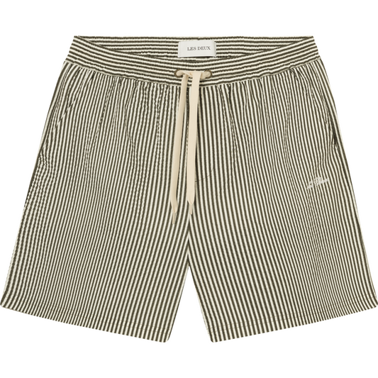 Les Deux Stan Stripe Seersucker Swim Shorts in Olive Night/Light Ivory with an embroidered logo on the left leg.