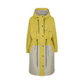 The Barbour Evie Showerproof Parka is a long two-tone yellow and beige jacket with an adjustable hood, black drawstrings, front pockets, and snap buttons, showcased on a white background.