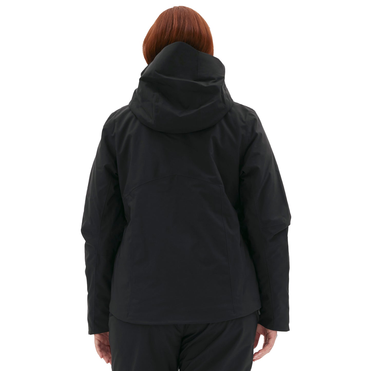 A woman wearing the insulated Lawrence Jacket by Halfdays stands with her back to the camera against a white background, ready for the slopes.