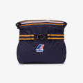 The K-Way Le Vrai 3.0 Claude in Blue Depth is a stylish bag with a striped belt, ring buckle, and brand logo on the front. Inspired by K-Way’s iconic unisex jacket, it’s photographed against a plain background.
