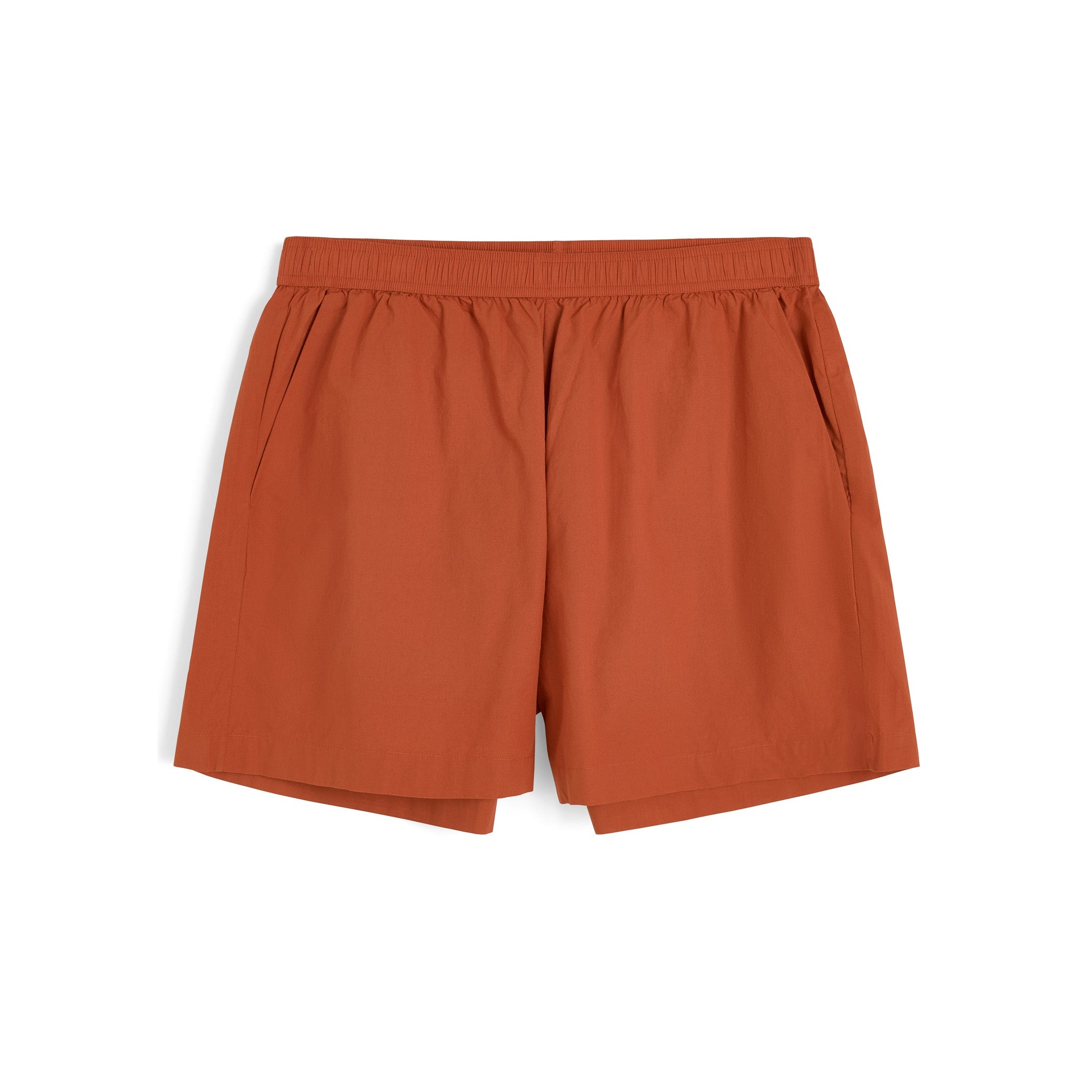 The Aiayu Lulu Poplin II are rust-colored organic cotton shorts with an elastic waistband, side pockets, and a comfortable oversized fit, shown laid flat on a white background.