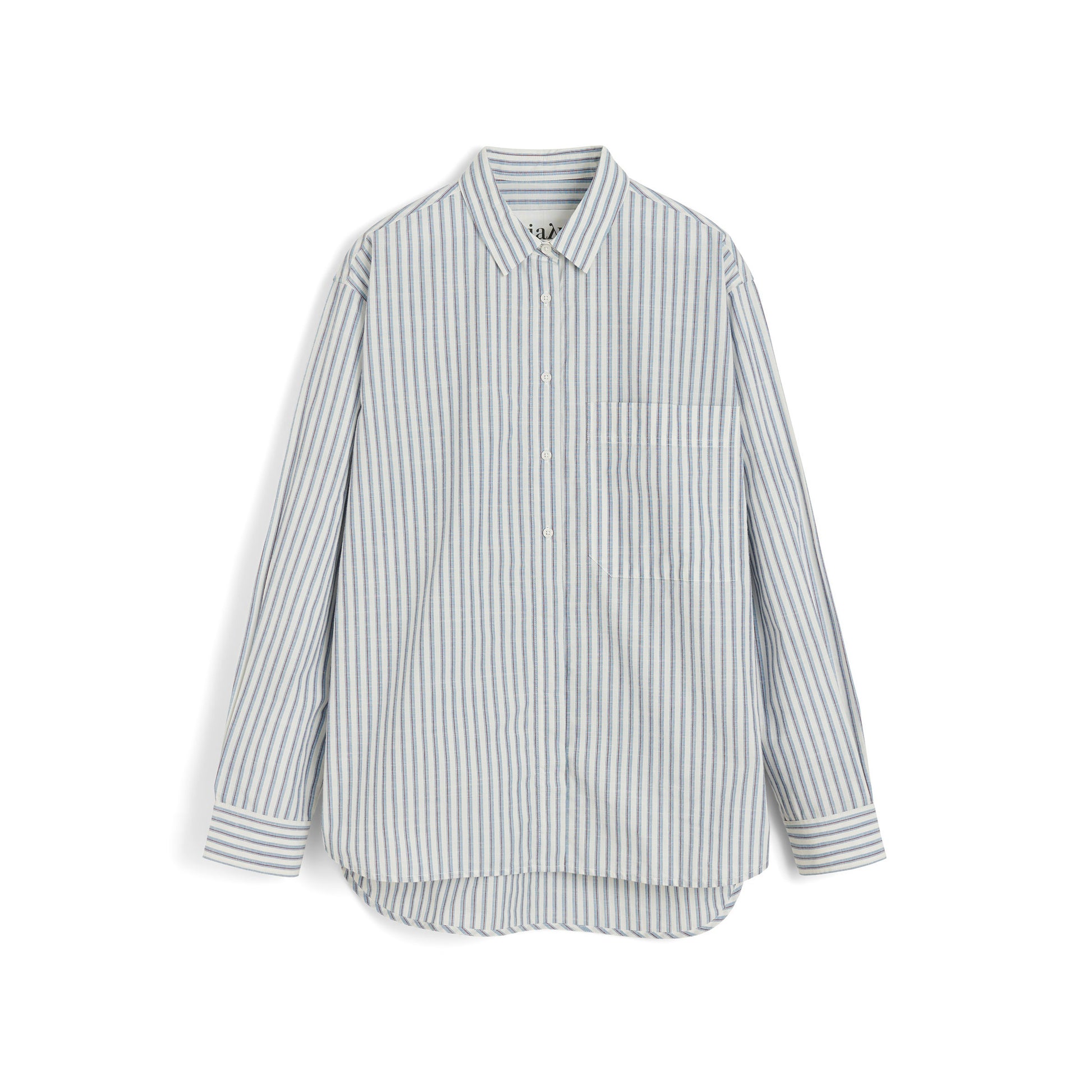 The Aiayu Lynette Chetna Cotton Shirt Verano is an oversized, long-sleeve button-up with blue and white stripes, a chest pocket, and a curved hem, crafted from organic cotton for effortless style.