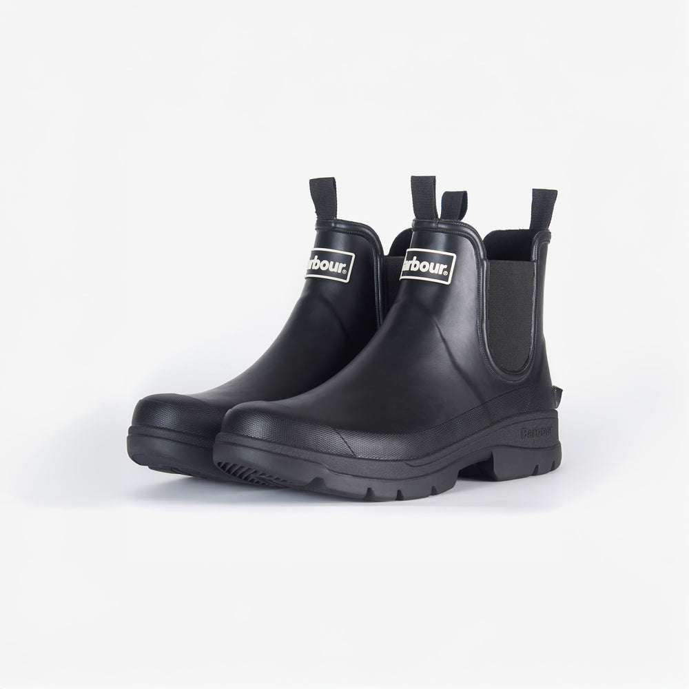 The Barbour Nimbus Chelsea Welly in black rubber boasts pull tabs, logo tags, and a sleek mudguard detail, set against a white background.