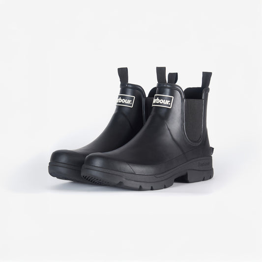 The Barbour Nimbus Chelsea Welly in black rubber boasts pull tabs, logo tags, and a sleek mudguard detail, set against a white background.