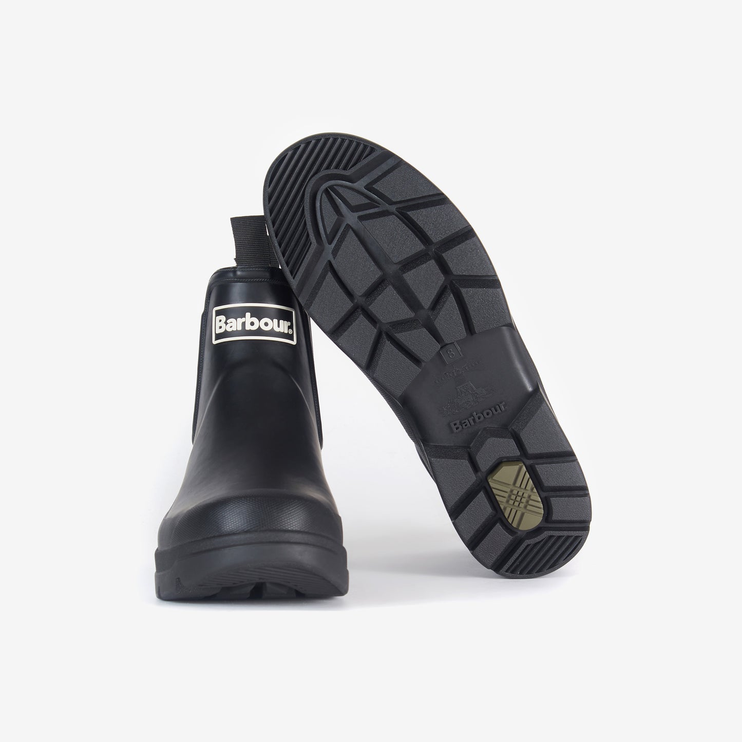 The Barbour Nimbus Chelsea Welly ankle boots, displayed upright and showing the tread pattern on the sole, provide a classic style with superior protection against wet conditions.
