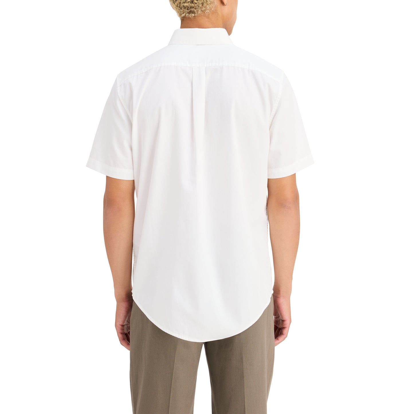 A person in a Dockers Men's Signature Shirt with Stain Defender, SS and beige pants made from Mechanical Stretch Twill stands with their back to the camera against a pristine white background.