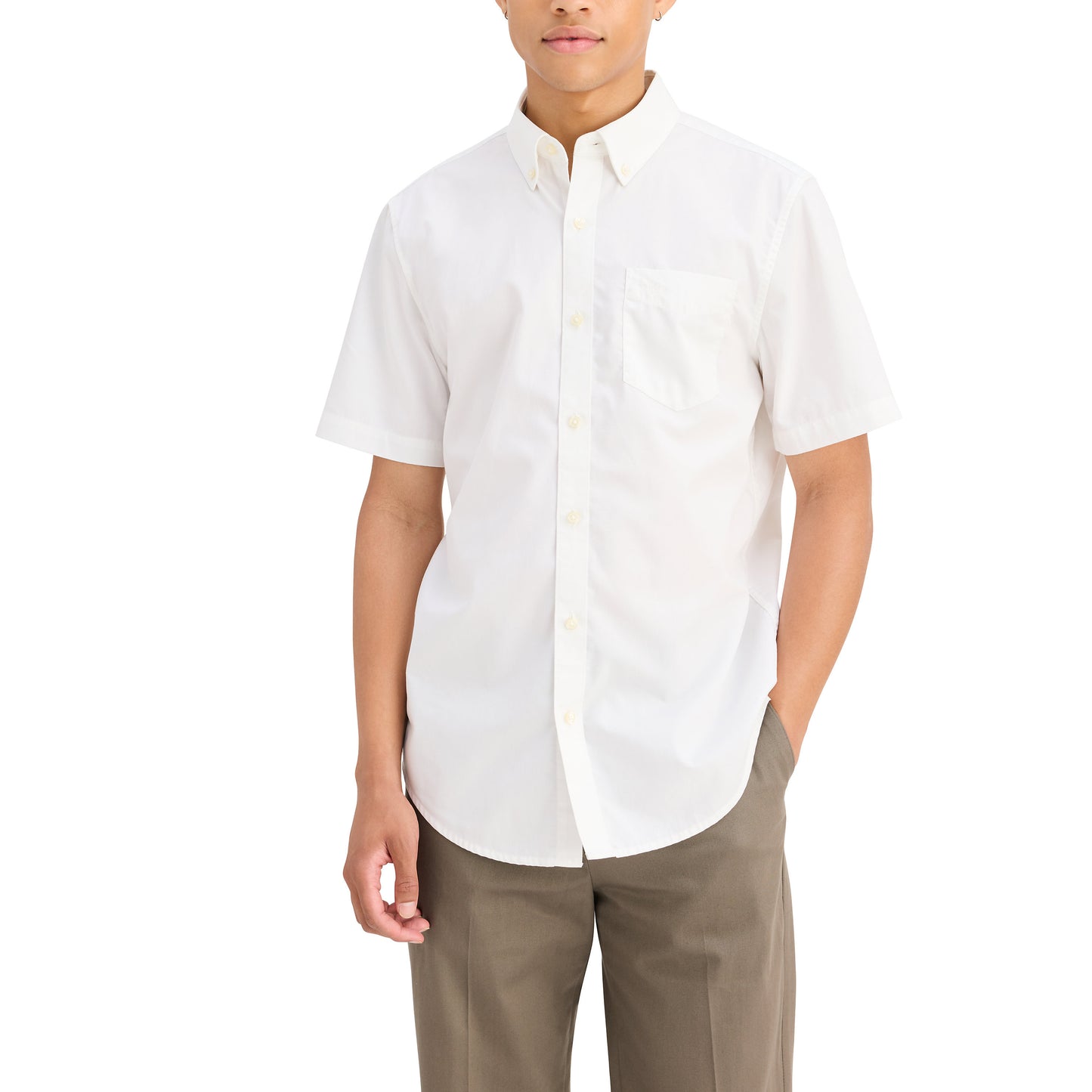 A person in a Dockers Men's Signature Shirt with Stain Defender, SS and brown Mechanical Stretch Twill pants stands against a plain white background.