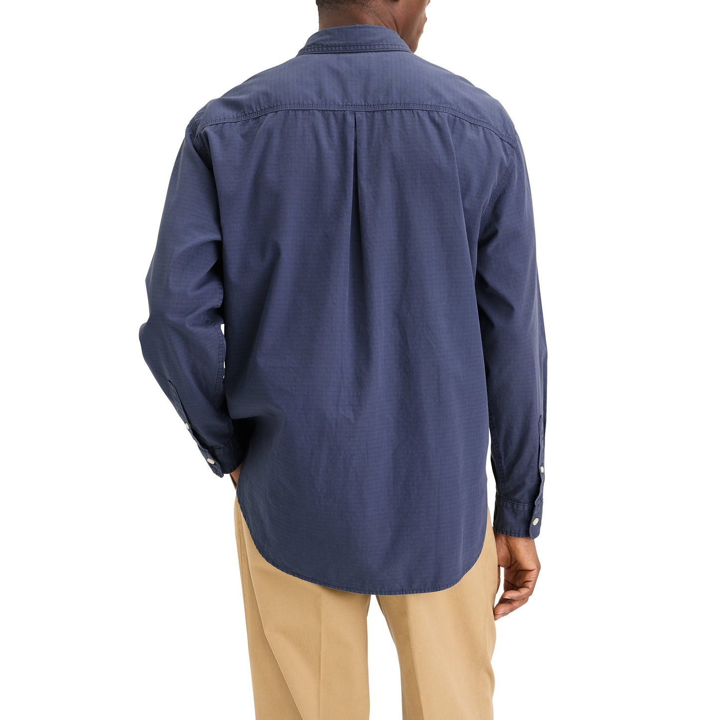 A person seen from the back is wearing a relaxed fit Dockers Genderless 86 1-Pocket Shirt, LS in blue and tan pants.