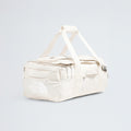 A spacious off-white Base Camp Voyager Duffel - 42L by The North Face with handles and zip pockets, lightweight for travel, shown on a plain light background—an ideal companion for your journeys.