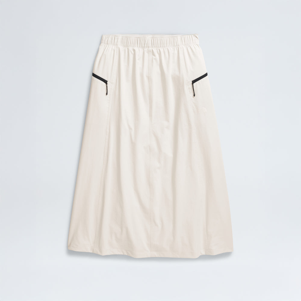 The North Face's W North Dome Wind Skirt is a long white skirt featuring an elastic waistband and black trim on two side pockets, shown against a plain background.