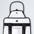 The North Face Base Camp Tote Bag features black trim, rope handles, button closures, durable construction, black straps, a front pocket, and smart internal organization—all shown against a plain background.