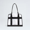 The North Face Base Camp Tote Bag features a durable white and black design, rope handles, black strap details, internal organization, and the brand logo on the front.