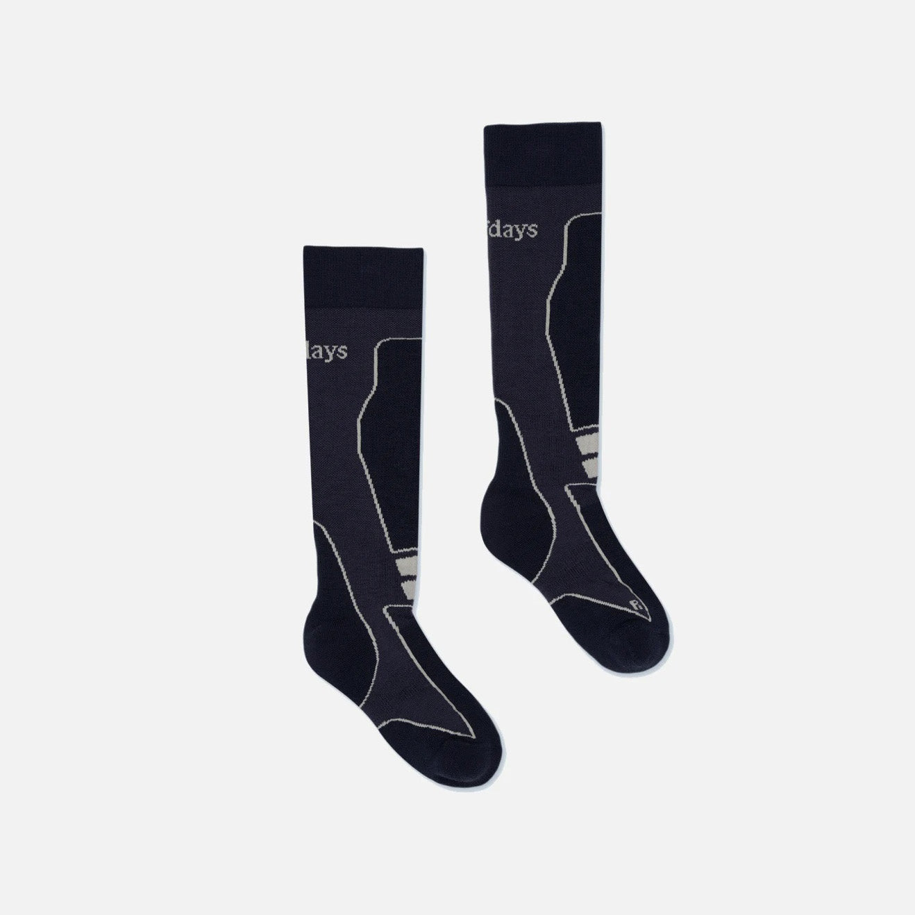 Two navy knee-high socks with off-white designs on a light gray background