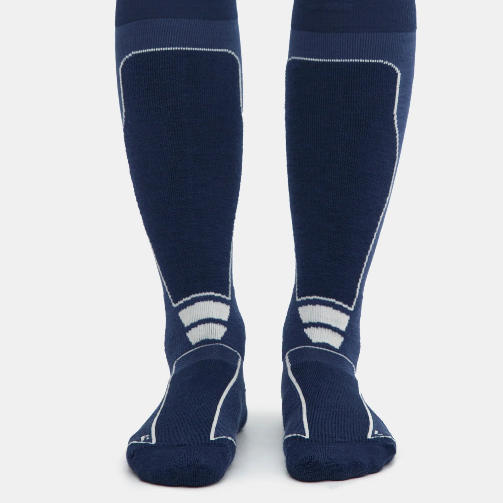 Two navy knee-high socks with off-white designs on a light gray background