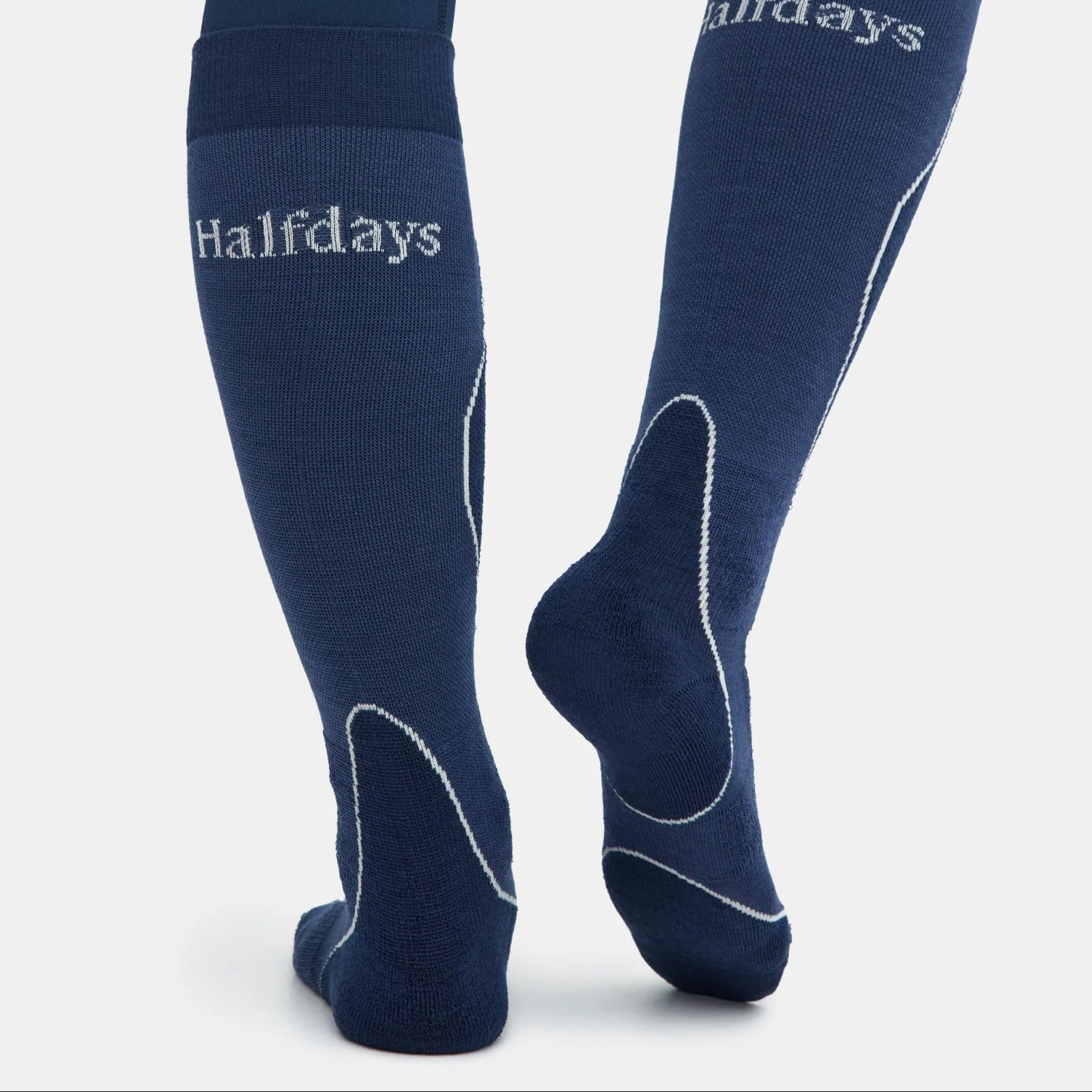 Navy blue knee-high socks with 'Halfdays' branding on a light gray background