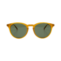 The New Depp sunglasses by Messyweekend feature an amber acetate frame with green-tinted lenses, providing UV400 protection for all-day comfort. Styled as unisex eyewear, they are perfect against a plain background.