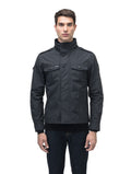 A person is wearing the Admiral Men's Jacket by Nobis, a sleek design with advanced fabric technology, high collar, and front pockets, against a white background.